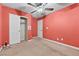 Bedroom featuring a ceiling fan, closet with double doors, and a separate white door at 4858 Longshot Dr, Las Vegas, NV 89122