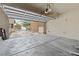 Open garage view showcasing the exterior street and white garage door at 4858 Longshot Dr, Las Vegas, NV 89122