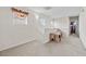 Hallway with carpet flooring, a table with printer, and natural light from two windows at 4858 Longshot Dr, Las Vegas, NV 89122