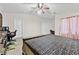 Another view of the spacious main bedroom with a ceiling fan and two closets at 4858 Longshot Dr, Las Vegas, NV 89122