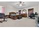 Spacious main bedroom with ceiling fan, carpet, and plenty of natural light at 4858 Longshot Dr, Las Vegas, NV 89122