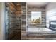 Spa-like bathroom showcasing a glass-enclosed shower, soaking tub, and elegant tile design at 5210 Villa Dante Ave, Las Vegas, NV 89141