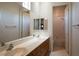 This staged bathroom features double sinks and a large mirror at 5210 Villa Dante Ave, Las Vegas, NV 89141