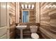 A stylish bathroom is decorated with horizontal wood-like accent tiles at 5210 Villa Dante Ave, Las Vegas, NV 89141