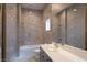 The bathroom features marble walls, gold fixtures, and a sleek vanity at 5210 Villa Dante Ave, Las Vegas, NV 89141