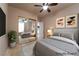 Staged bedroom with cool paint and gold accents reflecting in mirrored closet doors at 5210 Villa Dante Ave, Las Vegas, NV 89141