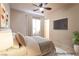 This staged bedroom offers natural light and modern decor at 5210 Villa Dante Ave, Las Vegas, NV 89141