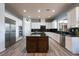 Spacious kitchen boasts granite countertops, stainless steel appliances, and a large center island at 5210 Villa Dante Ave, Las Vegas, NV 89141