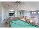 Upstairs loft area complete with a pool table, media center, and comfortable seating at 5210 Villa Dante Ave, Las Vegas, NV 89141