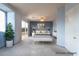 Serene main bedroom with a balcony, neutral color palette, and contemporary furnishings at 5210 Villa Dante Ave, Las Vegas, NV 89141