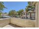 Balcony overlooking a charming community with lush landscaping and building exteriors at 5241 Caspian Springs Dr # 203, Las Vegas, NV 89120
