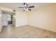 Spacious bedroom with laminate wood flooring, large window, and ceiling fan at 5241 Caspian Springs Dr # 203, Las Vegas, NV 89120