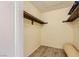Walk-in closet featuring laminate wood flooring and shelving at 5241 Caspian Springs Dr # 203, Las Vegas, NV 89120
