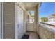 Private condo entrance featuring a covered walkway and a view of the surrounding complex at 5241 Caspian Springs Dr # 203, Las Vegas, NV 89120