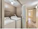 Laundry room featuring a full size washer and dryer and storage at 5241 Caspian Springs Dr # 203, Las Vegas, NV 89120