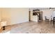 Open-concept living area with laminate flooring flowing into the kitchen, with neutral walls at 5241 Caspian Springs Dr # 203, Las Vegas, NV 89120