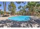 Inviting community pool with shaded seating areas and well-manicured landscaping at 5241 Caspian Springs Dr # 203, Las Vegas, NV 89120