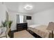 Bedroom featuring a dresser, mounted TV, ceiling light and large windows at 526 Sellers Pl, Henderson, NV 89011