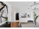 A dining area features a chandelier, wood floors and views to the kitchen at 526 Sellers Pl, Henderson, NV 89011
