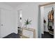 Hallway featuring a closet, table, plant, and entry to the bathroom at 526 Sellers Pl, Henderson, NV 89011