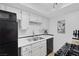 A kitchen features stainless steel appliances, white cabinets, and a tile backsplash at 526 Sellers Pl, Henderson, NV 89011