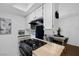 A modern kitchen features a breakfast bar with a gas range and dining area at 526 Sellers Pl, Henderson, NV 89011