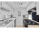 A kitchen boasts stainless steel appliances, white cabinets and subway tile backsplash at 526 Sellers Pl, Henderson, NV 89011