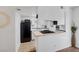 A modern kitchen with white cabinetry, subway tile backsplash and stainless steel appliances at 526 Sellers Pl, Henderson, NV 89011