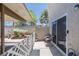 Private patio with seating and a view of the backyard and trees through a decorative fence at 526 Sellers Pl, Henderson, NV 89011