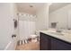 A full bathroom featuring tile flooring, shower, vanity and neutral walls at 529 Caribbean Palm Dr, Las Vegas, NV 89138