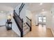 Inviting foyer with staircase, tile flooring, and ample natural light at 529 Caribbean Palm Dr, Las Vegas, NV 89138