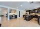 Spacious kitchen featuring a large island with seating, tile flooring, and modern appliances at 529 Caribbean Palm Dr, Las Vegas, NV 89138