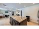 Modern kitchen island featuring granite countertops and custom dark wood cabinets at 529 Caribbean Palm Dr, Las Vegas, NV 89138