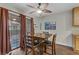 Cozy dining area featuring a sliding glass door to the outside and decorative artwork at 5465 Cardinal Ridge Ct # 103, Las Vegas, NV 89149