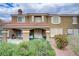 Charming two-story home showcasing a beautiful exterior with a tiled roof and well-maintained landscaping at 5465 Cardinal Ridge Ct # 103, Las Vegas, NV 89149