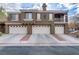 Attractive townhome complex with well-maintained garages and manicured landscaping, offering curb appeal at 5465 Cardinal Ridge Ct # 103, Las Vegas, NV 89149