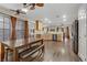 Expansive living space featuring hardwood floors, a dining area, and a view of the kitchen at 5465 Cardinal Ridge Ct # 103, Las Vegas, NV 89149
