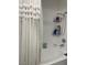 Bright bathroom with a shower-tub combo and a variety of personal care products at 5576 W Rochelle Ave # 13A, Las Vegas, NV 89103