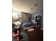 Cozy bedroom with blue walls and ceiling fan, creating a relaxed atmosphere at 5576 W Rochelle Ave # 13A, Las Vegas, NV 89103