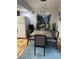 Dining room with gray table, four chairs, and pendant lighting creating an inviting atmosphere at 5576 W Rochelle Ave # 13A, Las Vegas, NV 89103