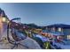 Captivating backyard featuring a sparkling pool, cozy lounge, and elegant hanging chair, perfect for relaxation at 5635 Mesa Mountain Dr, Las Vegas, NV 89135