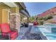 Backyard pool with a waterfall, spa, covered patio and well-manicured landscaping at 5635 Mesa Mountain Dr, Las Vegas, NV 89135