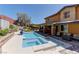 Beautiful backyard with pool, spa, patio, lush landscaping and great views at 5635 Mesa Mountain Dr, Las Vegas, NV 89135