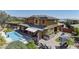 Large backyard with a pool, patio, lounging area, and manicured landscaping at 5635 Mesa Mountain Dr, Las Vegas, NV 89135