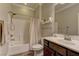 Cozy bathroom with shower-tub combo, neutral walls, and updated vanity at 5635 Mesa Mountain Dr, Las Vegas, NV 89135