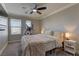 Bedroom featuring a ceiling fan, large windows, and exercise equipment at 5635 Mesa Mountain Dr, Las Vegas, NV 89135