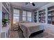 Cozy bedroom with built-in shelves, a ceiling fan, and lots of natural light at 5635 Mesa Mountain Dr, Las Vegas, NV 89135