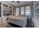 Bright bedroom featuring built-in shelves, neutral tones, and large windows at 5635 Mesa Mountain Dr, Las Vegas, NV 89135