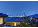Rooftop view of the vibrant city skyline, captured from a serene residential neighborhood, showcasing the glittering lights at 5635 Mesa Mountain Dr, Las Vegas, NV 89135