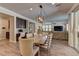 Open dining area connects the living room, kitchen and features a modern light fixture at 5635 Mesa Mountain Dr, Las Vegas, NV 89135